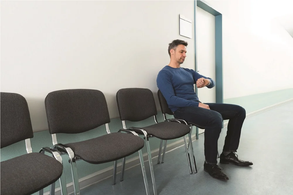 A patient waiting outside doctor room in clinic